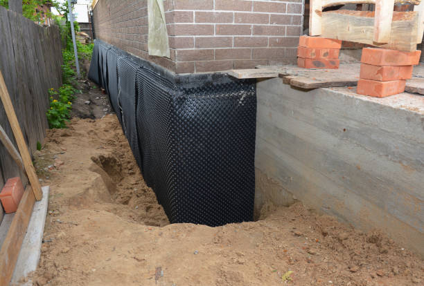 Happy homeowners after waterproofing job in Loveville